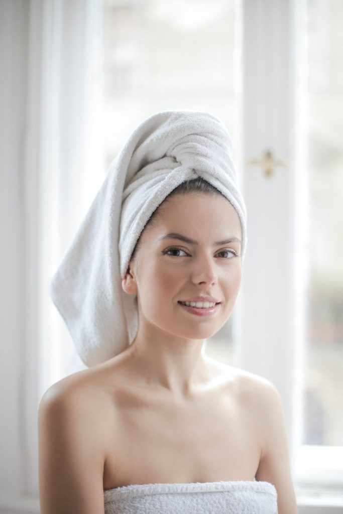 Gorgeous bride with towel and clean, glowing skin
