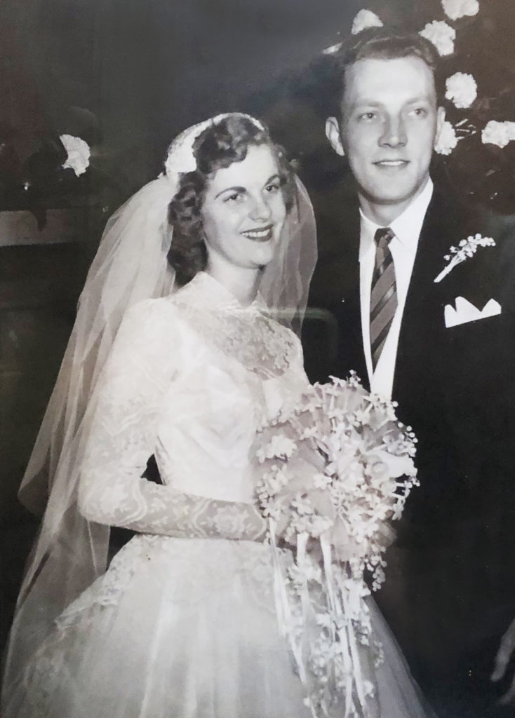 1950s era bride with fingertip bridal veil for her wedding. This elegance is another reason to wear a veil for your wedding