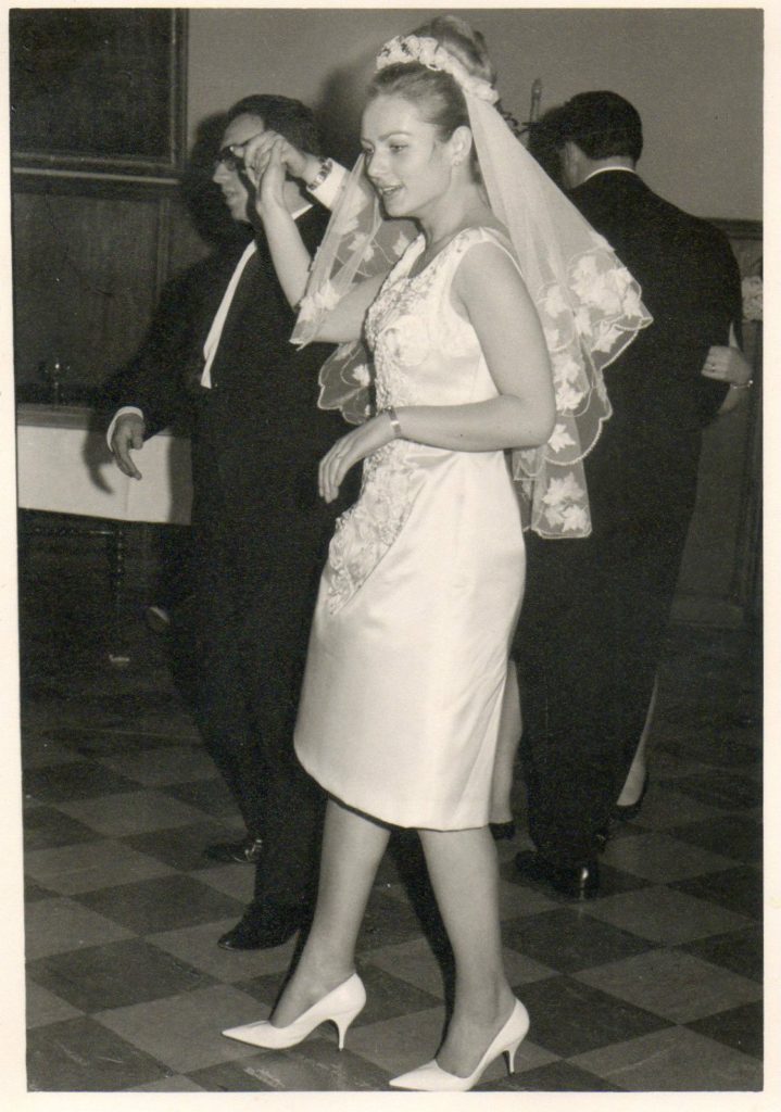 1960s bride with fun floral veil and short dress