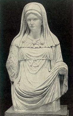 Roman sculpture of vestal virgin. She is wearing a veil which symbolizes chastity early in history.