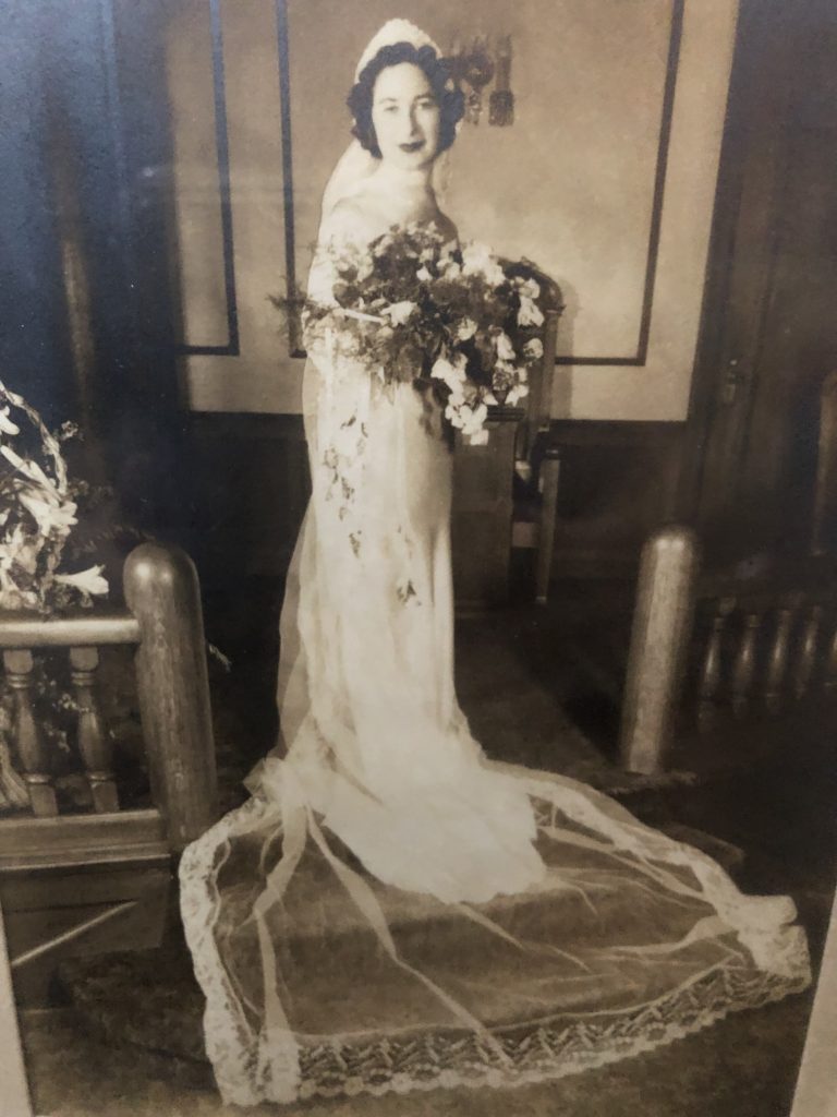 photo of 1930s bride with long train and cathedral length veil