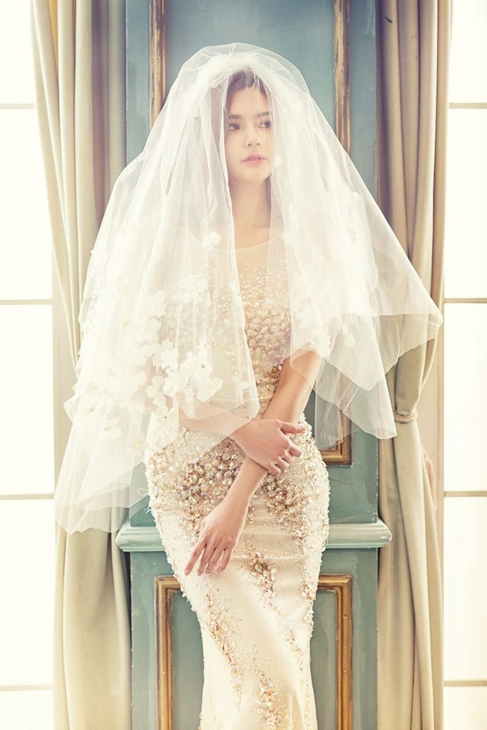 gorgeous bride with a sheer veil and beaded wedding gown. Another reason to wear a veil for your wedding